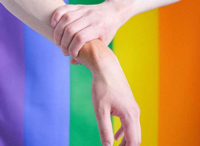 arms-in-front-of-a-gay-pride-flag-4611697 arms-in-front-of-a-gay-pride-flag-4611697