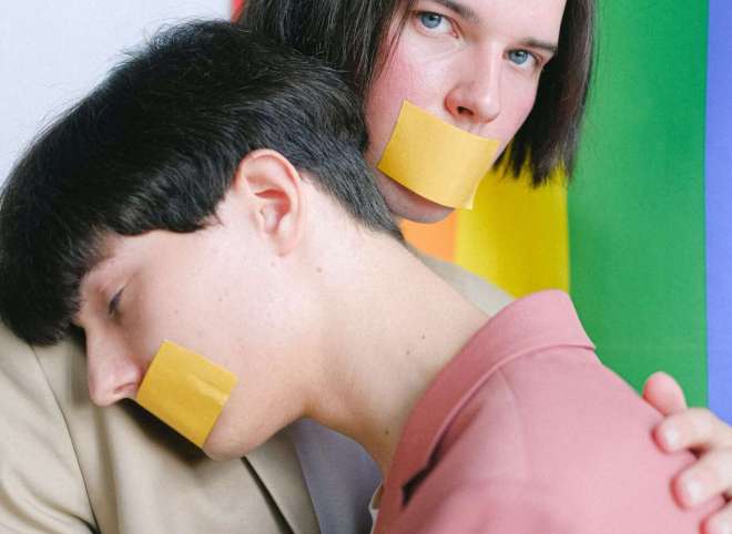 two-men-with-adhesive-tape-over-their-mouth-hugging-4611699 two-men-with-adhesive-tape-over-their-mouth-hugging-4611699